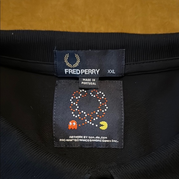 Fred Perry Black Polo Shirt with Unique Sleeve Design and Decorative Hem - Picture 2 of 6